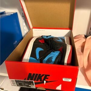 Nike Air Jordan 1 Retro High in Black, Blue, and Red